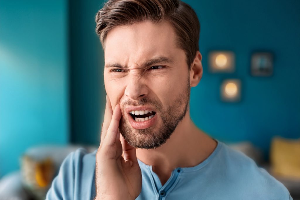 Man with sensitive teeth
